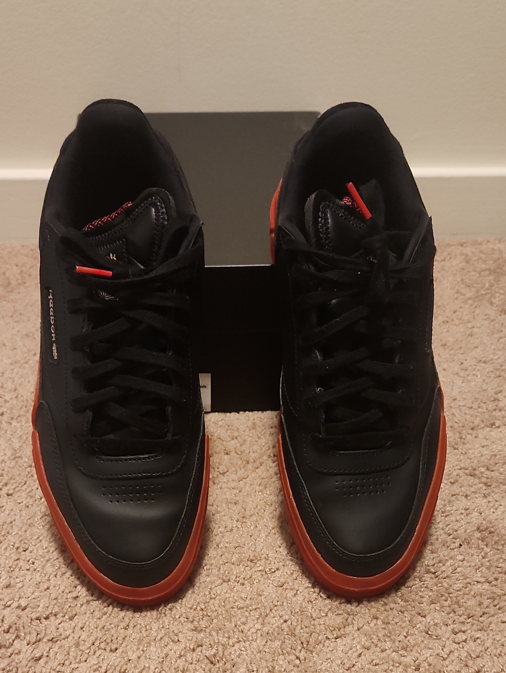 Reebok Women's Black and Red Low-Top Sneakers with Red Accents